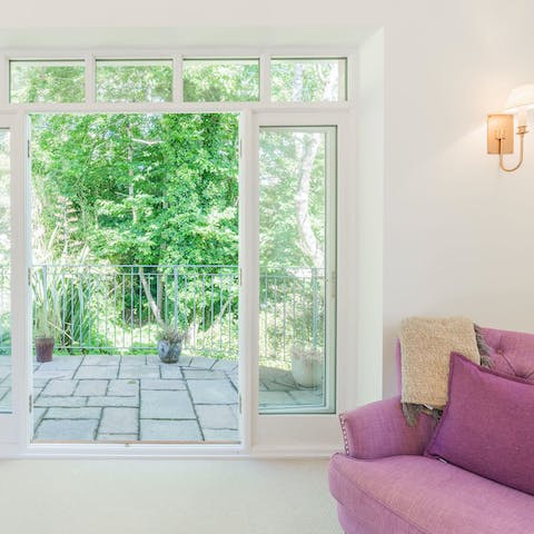 Open the patio doors and enjoy leafy garden views from the living room