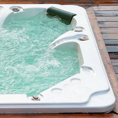 Relax and unwind in the private hot tub