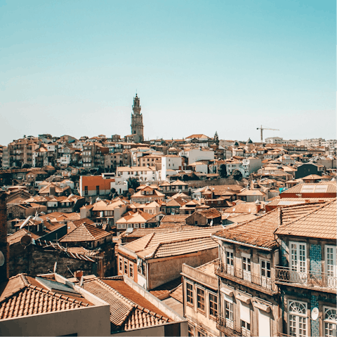 Visit a rooftop bar to take in the magnificent views of Porto