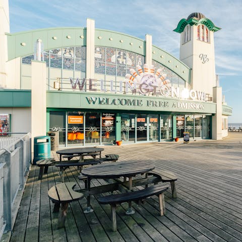 Walk four minutes to Wellington Pier and play a game in the arcade