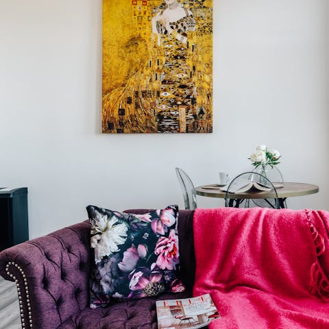 Cuddle up on the purple sofa and watch your favourite shows on the smart TV