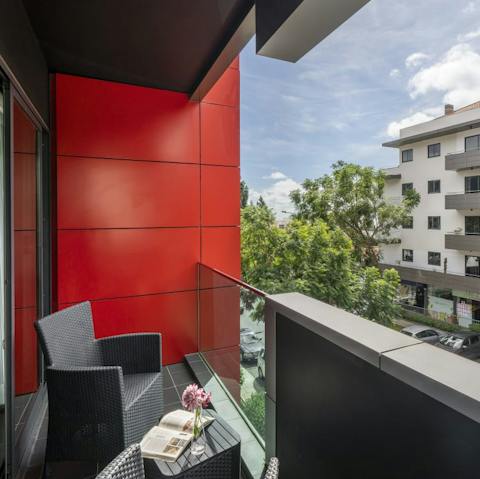 Get a feel for the local vibe from your apartment's sunlit balcony