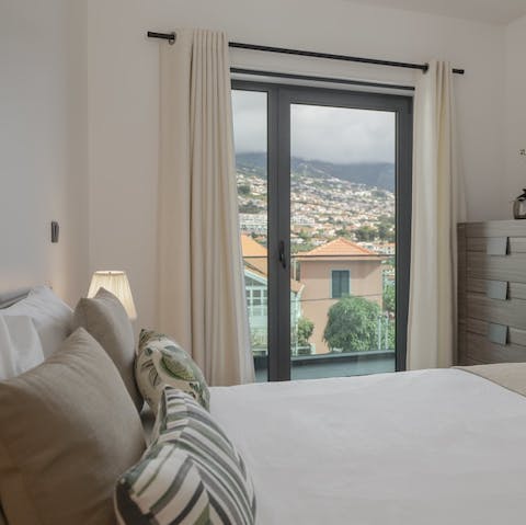 Take in the scenic vista of Funchal's surrounding hills from the comfort of your own cosy bed