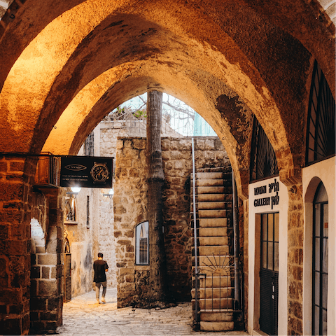 Discover Old Jaffa's winding alleyways, a five-minute walk away