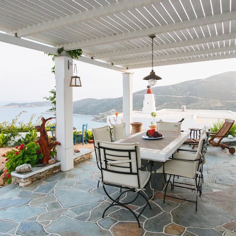 Dine alfresco and admire the beautiful views across the Aegean Sea