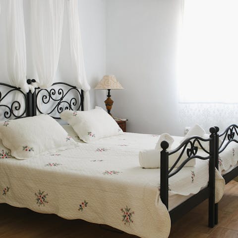 Fall asleep in the wrought-iron canopy beds and wake up ready for adventure