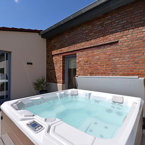 Feel the warmth of the outdoor jacuzzi wash over you no matter what the time of year