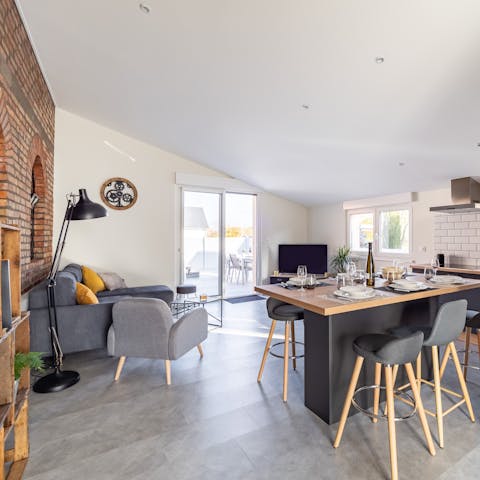 Follow the red brick wall to your open plan living area – ideal for sociable evenings with loved ones