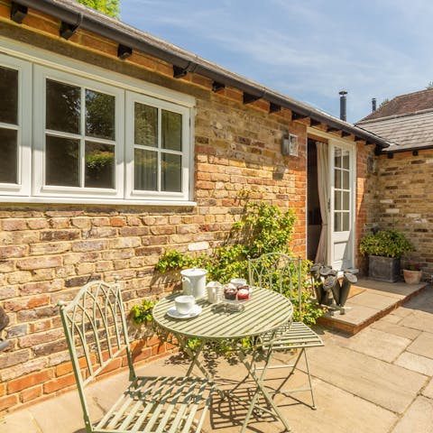 Take in the scent of the lavenders and roses on the sunny patio