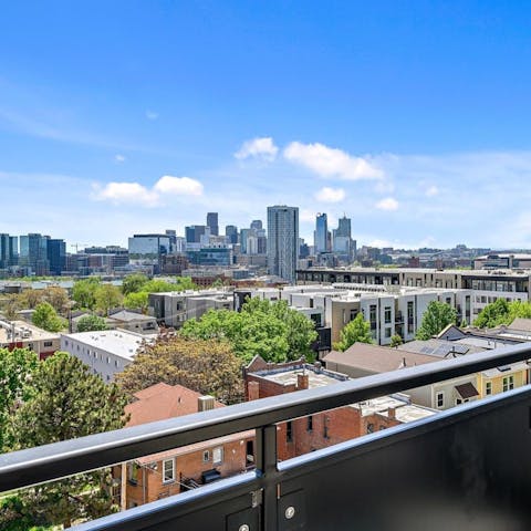 Take in views of the Denver skyline from the private balcony