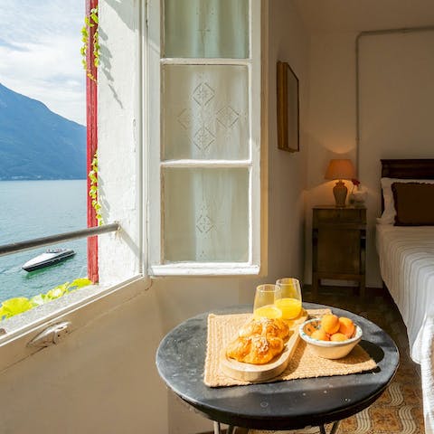 Tuck into breakfast while overlooking the lake from the bedroom