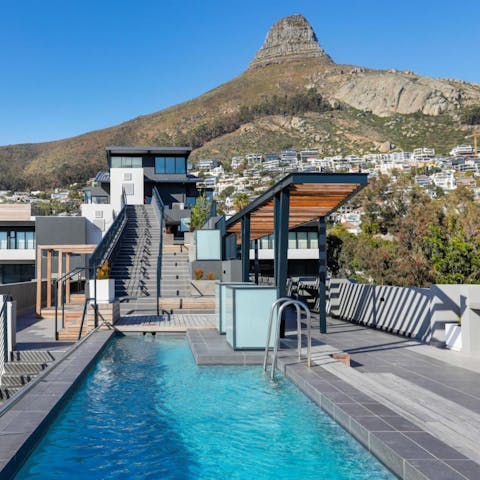 Head up to the shared roof deck for a swim with a view