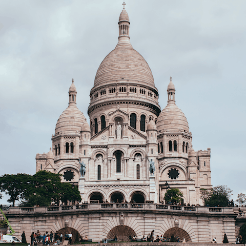 Gaze up at the beautiful  Sacré Coeur Basilica, a seventeen-minute walk away