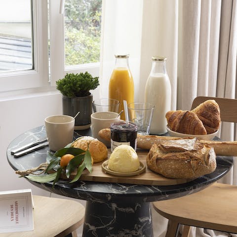 Start mornings with fresh coffee and croissants at the window-side table before setting out to tour the city