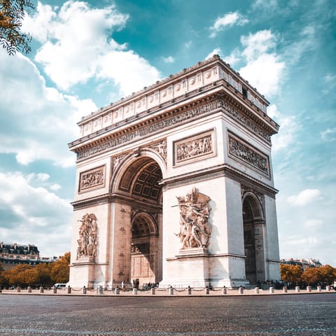 Walk just a few minutes to Arc de Triomphe to visit the Unknown Soldier