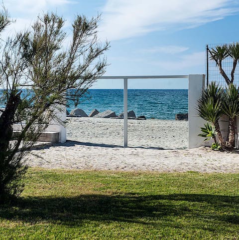 Wander down to the edge of the garden and step directly onto the sandy beach