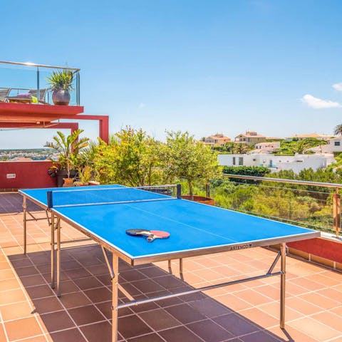 Get competitive over a game of ping pong in the sunshine 