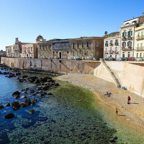 Take a dip in the sea from the small, shingle Cala Rossa Beach, a four-minute walk away
