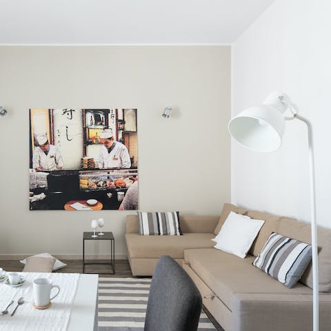 Relax in the living room with a glass of Italian wine after a day of exploring