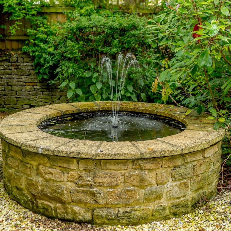 Listen to the soothing sounds of the fountain in the raised pond