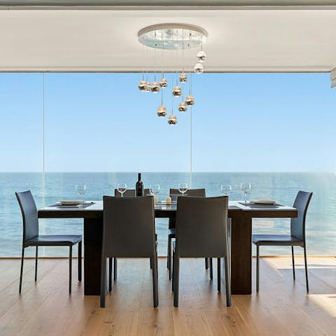 Enjoy a glass of Californian rosé and the sea views at the dining table