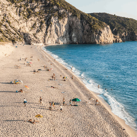 Sink your toes in the sand at Paralia Agios Ioannis, a one-minute walk away