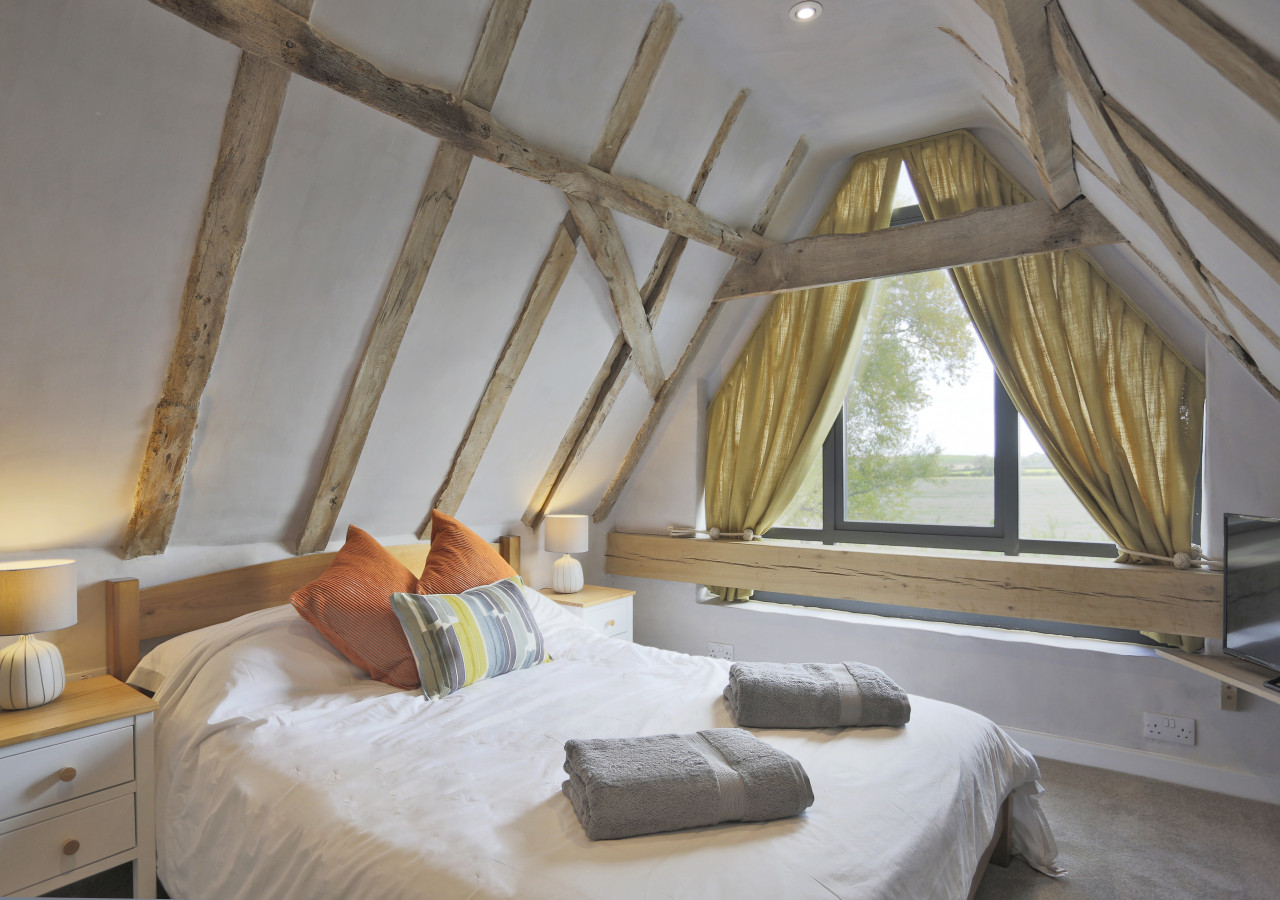 Enjoy far-reaching views towards the river from the characterful bedroom