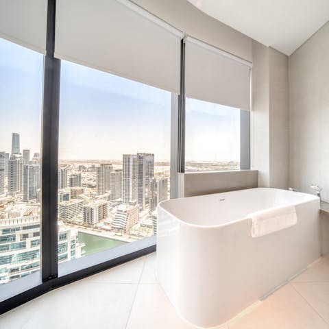 Unwind in the main bedroom's elegant bathtub