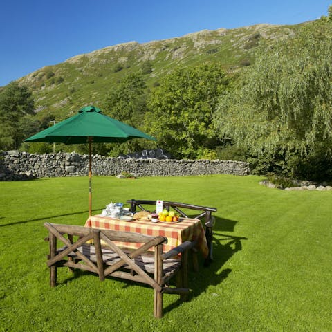 Dine in the grassy paddock beneath the fells