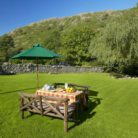 Dine in the grassy paddock beneath the fells