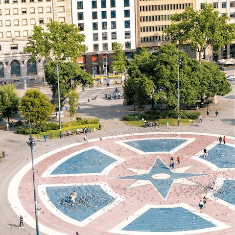 Take a seven-minute stroll to the bustling Plaça de Catalunya