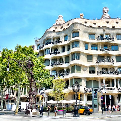 Admire Casa Milà, a twelve-minute stroll from your doorstep