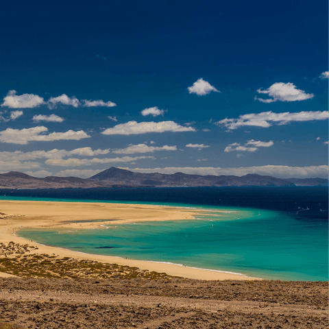 Explore Fuerteventura and its golden beaches, turquoise waters, quaint towns, and majestic mountains