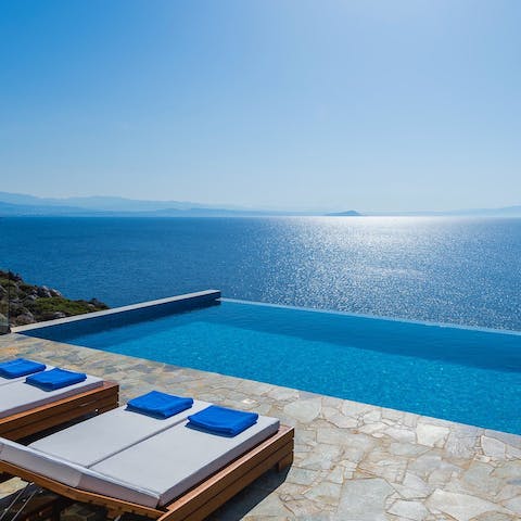 Soak up the gorgeous views of the Aegean sea from your sun lounger or the sleek infinity pool