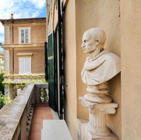 Step out onto the narrow balcony overlooking the beautiful residence gardens