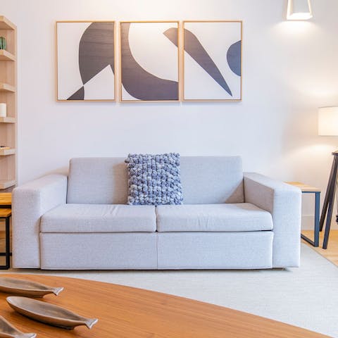 Take the weight of your feet and have a rest on the comfy grey sofa after exploring Lisbon