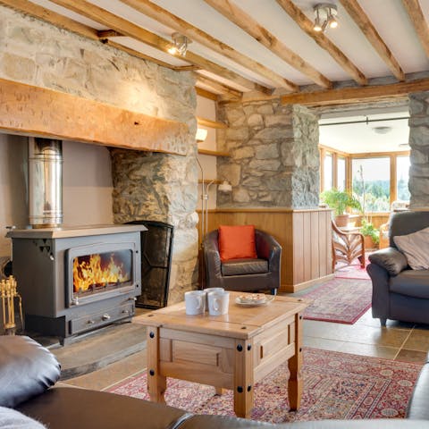 Enjoy the cosy glow from the living room's wood burning stove
