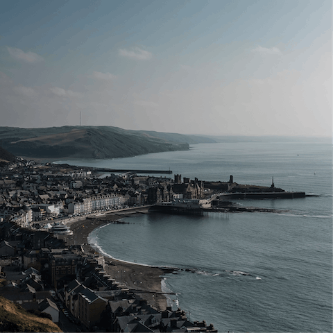 Explore Aberystwyth and its vibrant pier, beaches, local attraction, seafront restaurants and more 