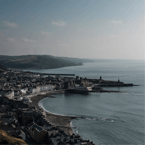 Explore Aberystwyth and its vibrant pier, beaches, local attraction, seafront restaurants and more