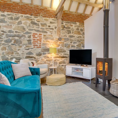 Get cosy in front of the warming fire, choosing a comforting film to watch while nursing a glass of red wine