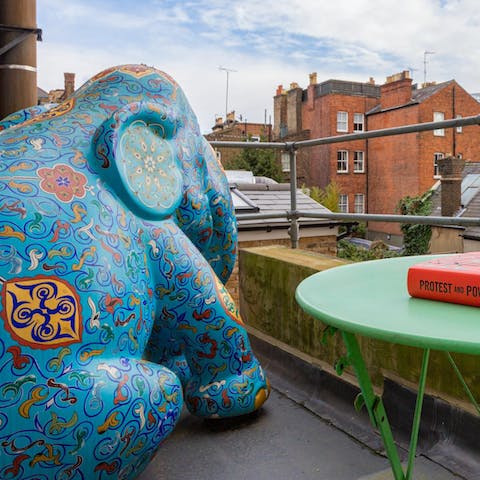 Sip your morning coffee on the balcony next to the giant elephant sculpture