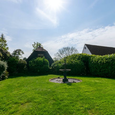 Read a book as you relax on the grass in the garden