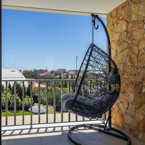 Sit out on the private balcony with expansive views, in the shade from the sun