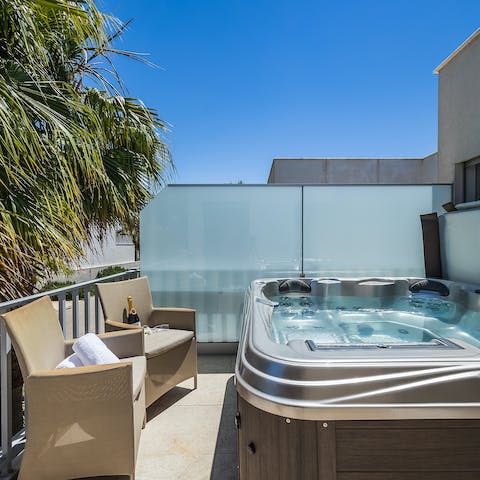 Jump in the Jacuzzi with some drinks and get the bubbles going for a relaxing and luxurious afternoon