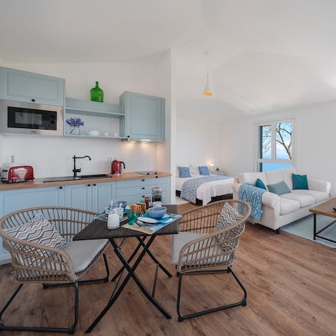 Stay in the annexe, with its living area, kitchenette and comfy king bed