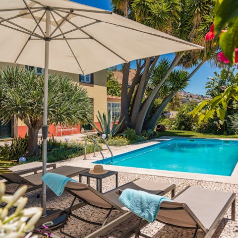 Take an afternoon siesta on the sun loungers by the pool, under the shade of the parasol