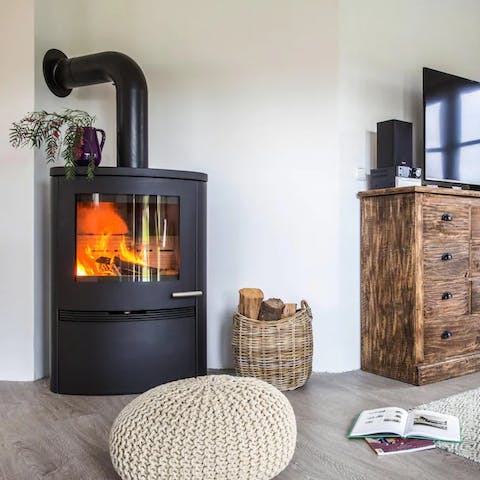 Spend cooler days curled up in front of the wood-burning stove