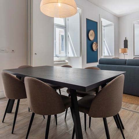Enjoy breakfasts of coffee and pastéis de nata on your sleek dining table
