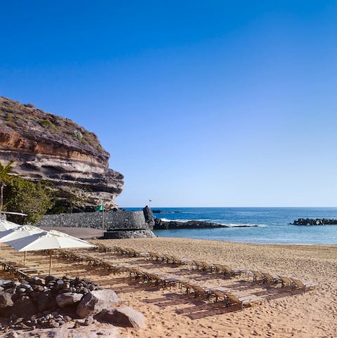 Catch some rays on the soft sands of Playa del Camisón, a short walk from home