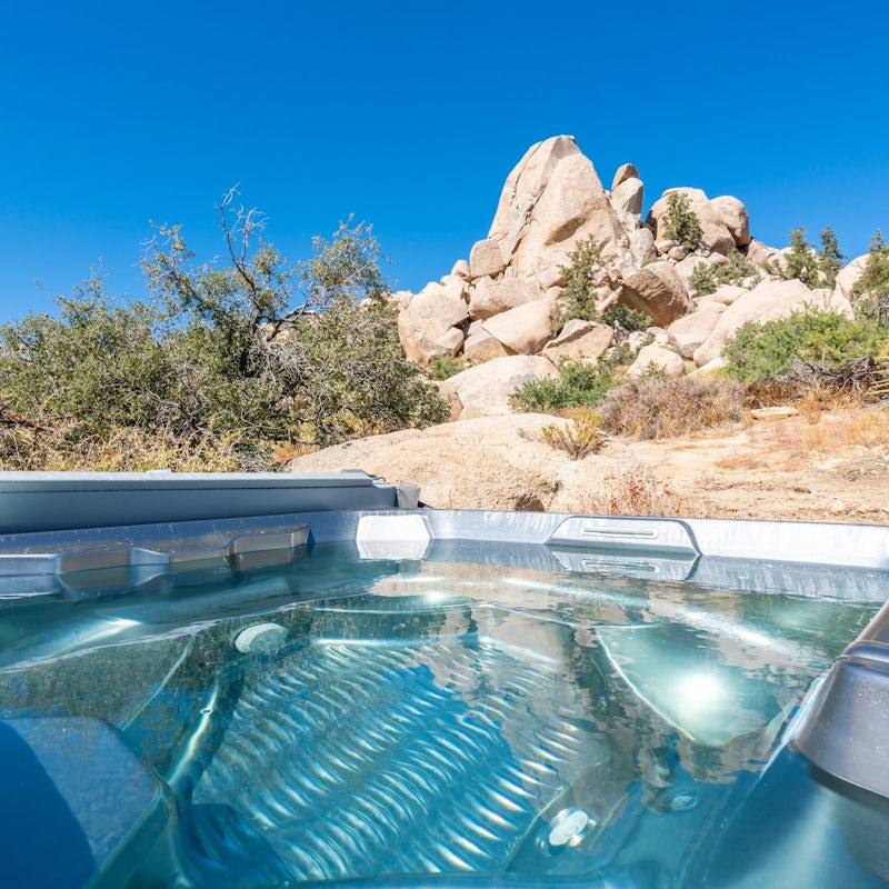 Look out at the otherworldly desert landscape from your salt-water hot tub